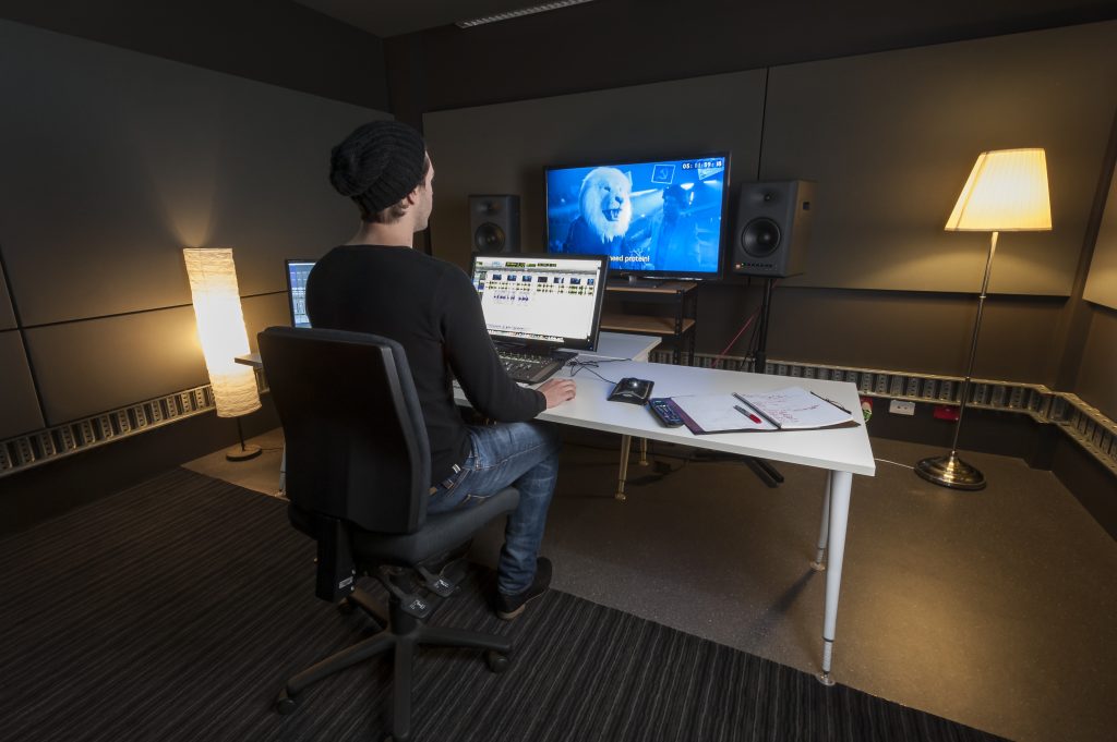 Man working in the Adelaide Studios Sound Edit Studio, photo by Sam Oster