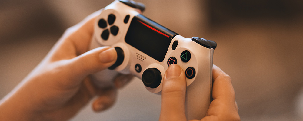 Person holding gaming controller