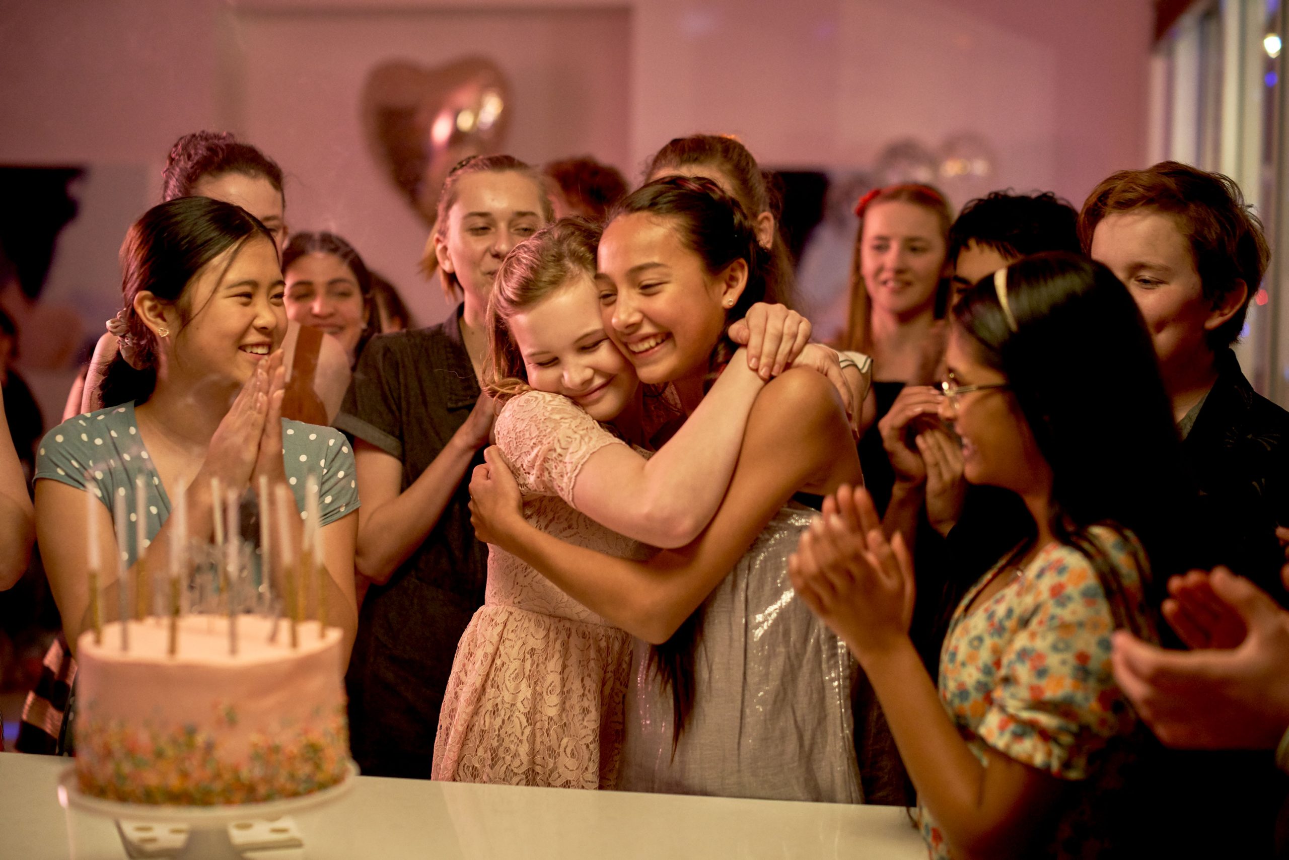 First Day (2019): Evie Macdonald hugs Arwen Diamond, while Elena Liu and Nandini Rajagopal look on. Photo by ian Routledge, courtesy Epic Films