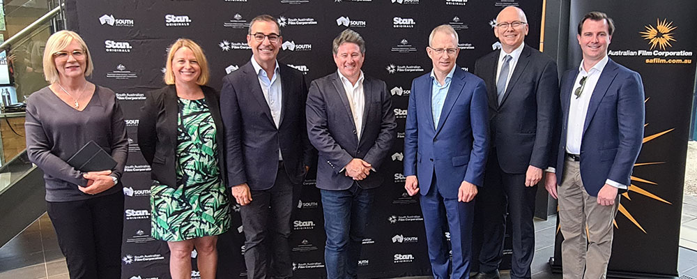 L-R: Producer Lisa Scott, SAFC CEO Kate Croser, SA Premier Steven Marshall, Stan CEO Mike Sneesby, Minister for Communications, Cyber Safety and the Arts Paul Fletcher, SA Minister for Innovation and Skills David Pisoni, James Stevens MP Federal Member for Sturt
