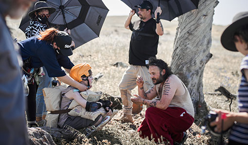 Eadan McGuinness with Daniel Henshall and crew on location for A Sunburnt Christmas, image copyright Every Cloud Productions, photo by Ian Routledge.