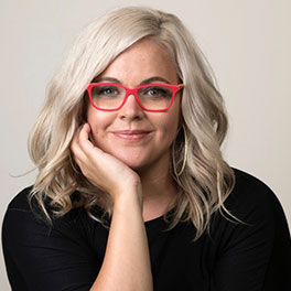 Filmmaker Taryn Brumfitt resting her chin on her hand