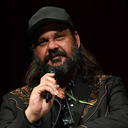 Filmmaker Warwick Thornton holding a microphone