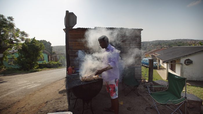 A man cooks a Barbecue outdoors