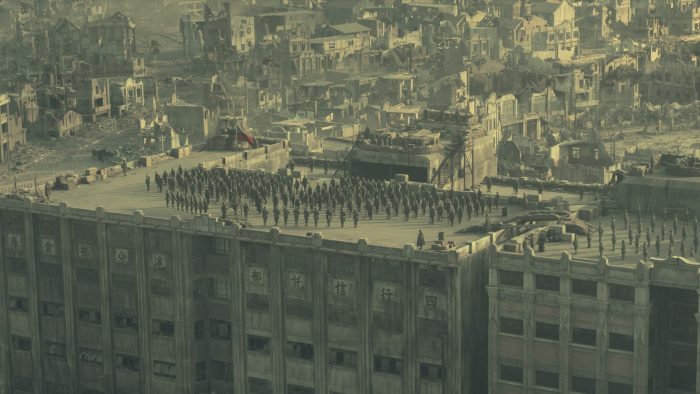 A still from The Eight Hundred - a large group of people are in formation on the rooftop of a building.