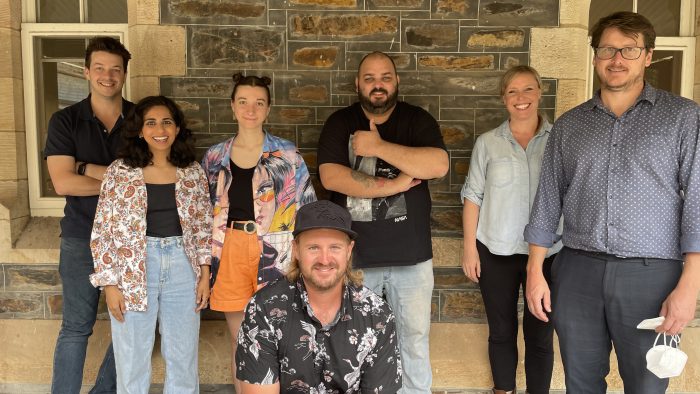 The three successful teams stand against a brick wall ; 1. Tom Phillips, Leela Varghese, Emma Hough Hobbs, 2. Josh Trevorrow (front) Travis Akbar, (not pictured - Thibul Nettle) 3. Alies Sluiter and William Littleton