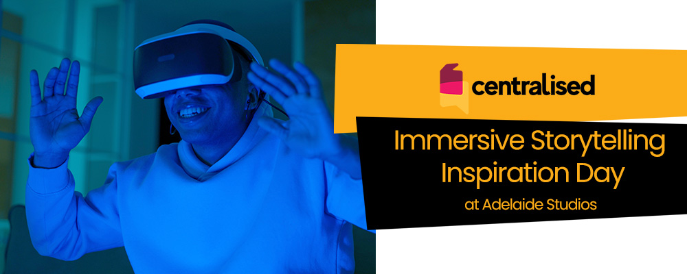 A man wearing a VR headset, bathed in blue light, and words reading "Centralised Immersive Storytelling Inspiration Day at Adelaide Studios"