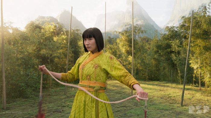 A still of a woman holding a rope in a fighting stance