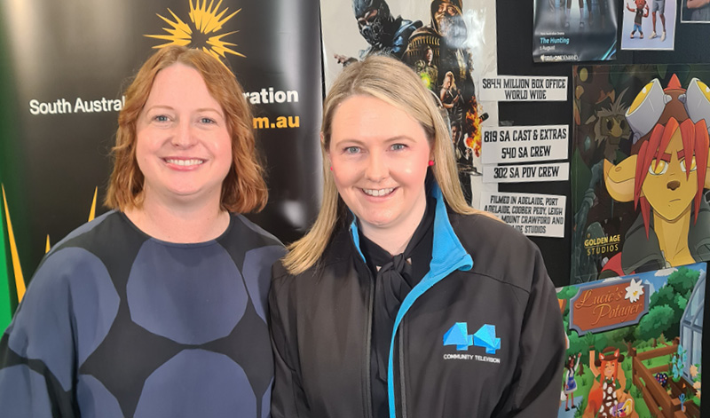 SAFC CEO Kate Croser Channel with 44 General Manager and SAFC Board Member Lauren Hillman in front of the SAFC Student Pathways and Careers Expo display.