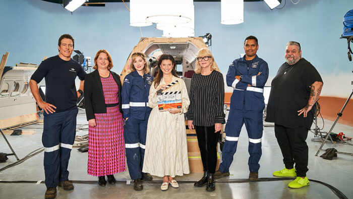 RFDS L-R: Stephen Peacocke, SAFC CEO Kate Croser, Emma Hamilton, Arts Minister Andrea Michaels MP, producer Lisa Scott, Rob Collins and director Adrian Russell Wills on set at the SAFC's Adelaide Studios. Photo credit Ian Routledge