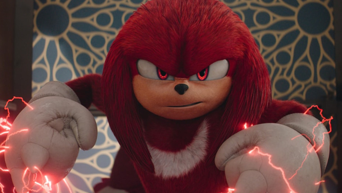 Knuckles glares at the camera. Electricity radiates off his closed fists.