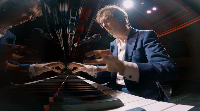 Ben Folds plays piano.