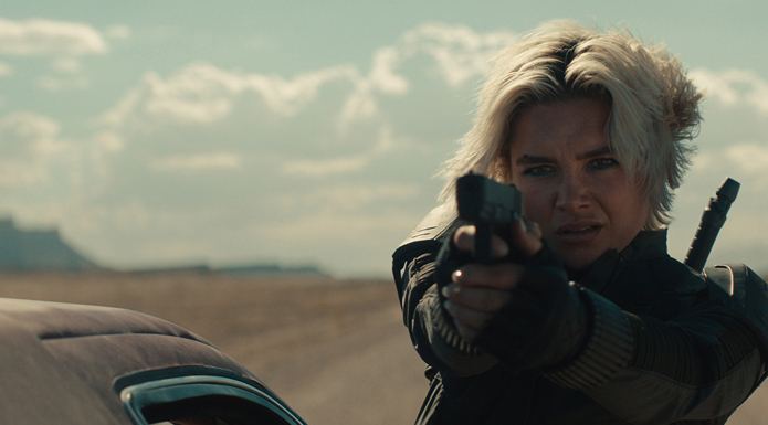 Florence Pugh points a gun in Thunderbolts.